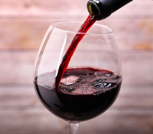 Pouring red wine into glass